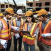 Construction workers discussing project handover